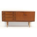 Mid century teak sideboard with three drawers and a pair of cupboard doors, 78cm H x 152cm W x