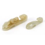 Two Chinese white jade belt hooks carved with dragons, the largest 6.2cm in length : For Further