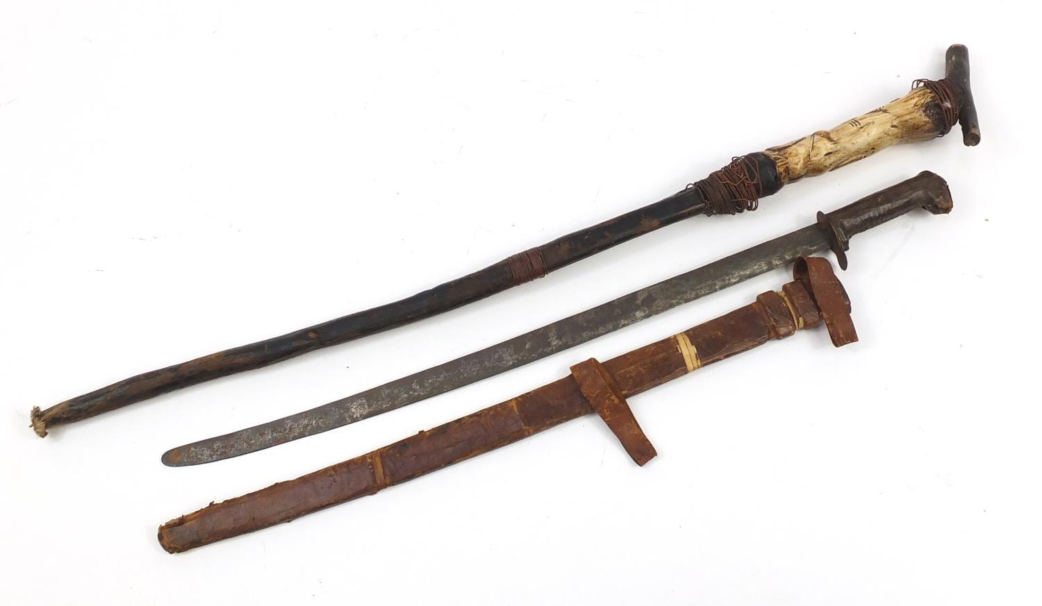 African cane with carved bone figural handle and a steel bladed sword with leather sheaf, the - Image 2 of 6