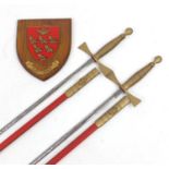 Pair of Masonic interest ceremonial dress swords together and a wall mounted shield with the East