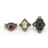 Three silver rings set with semi precious stones including garnet and turquoise, various sizes, 15.