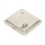 Turner & Simpson, silver compact with applied military crest and engine decoration, Birmingham 1947,