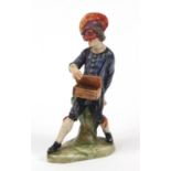 19th century Continental porcelain figure of an entertainer, factory marks to the base, 11.5cm