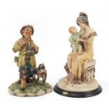 Capodimonte huntsman with his dog and a figure group of a mother and child, the largest 35cm