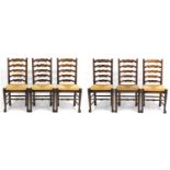 Set of six oak wavy ladder back chairs with rush seats, 100cm high : For Further Condition Reports