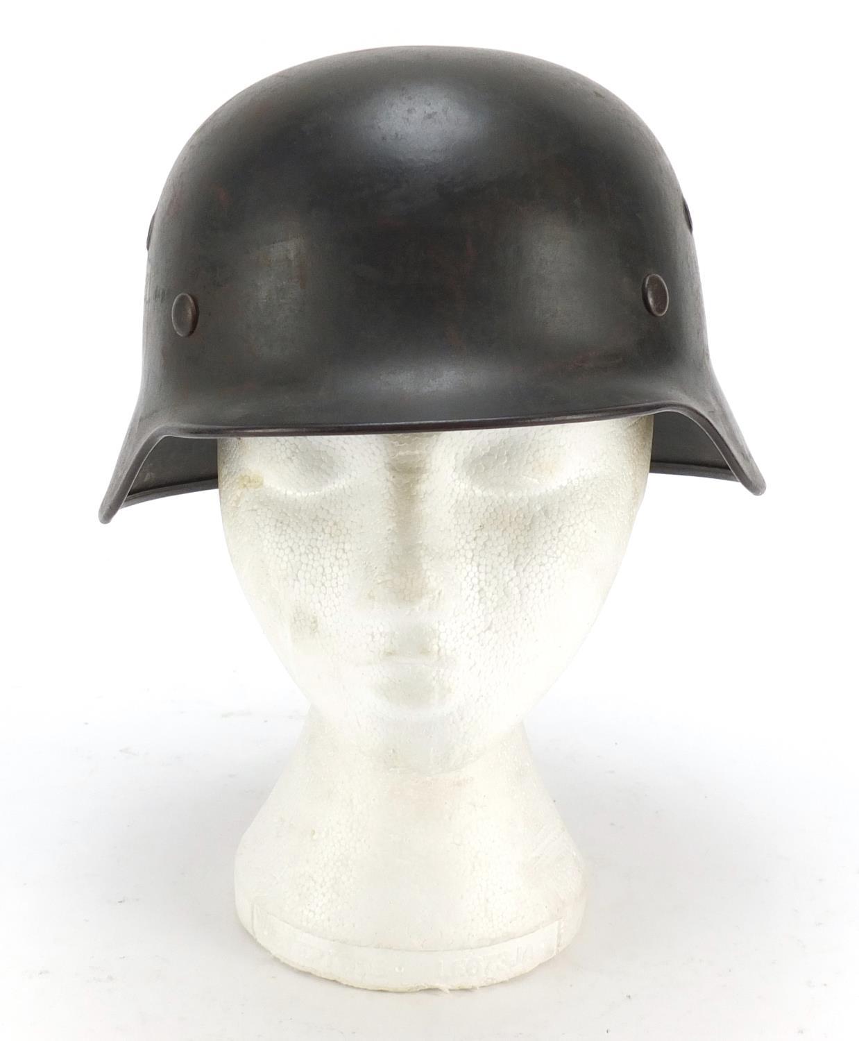 German military interest steel helmet with SS badge and leather liner, impressed 1256 and ET64 : For - Image 6 of 6