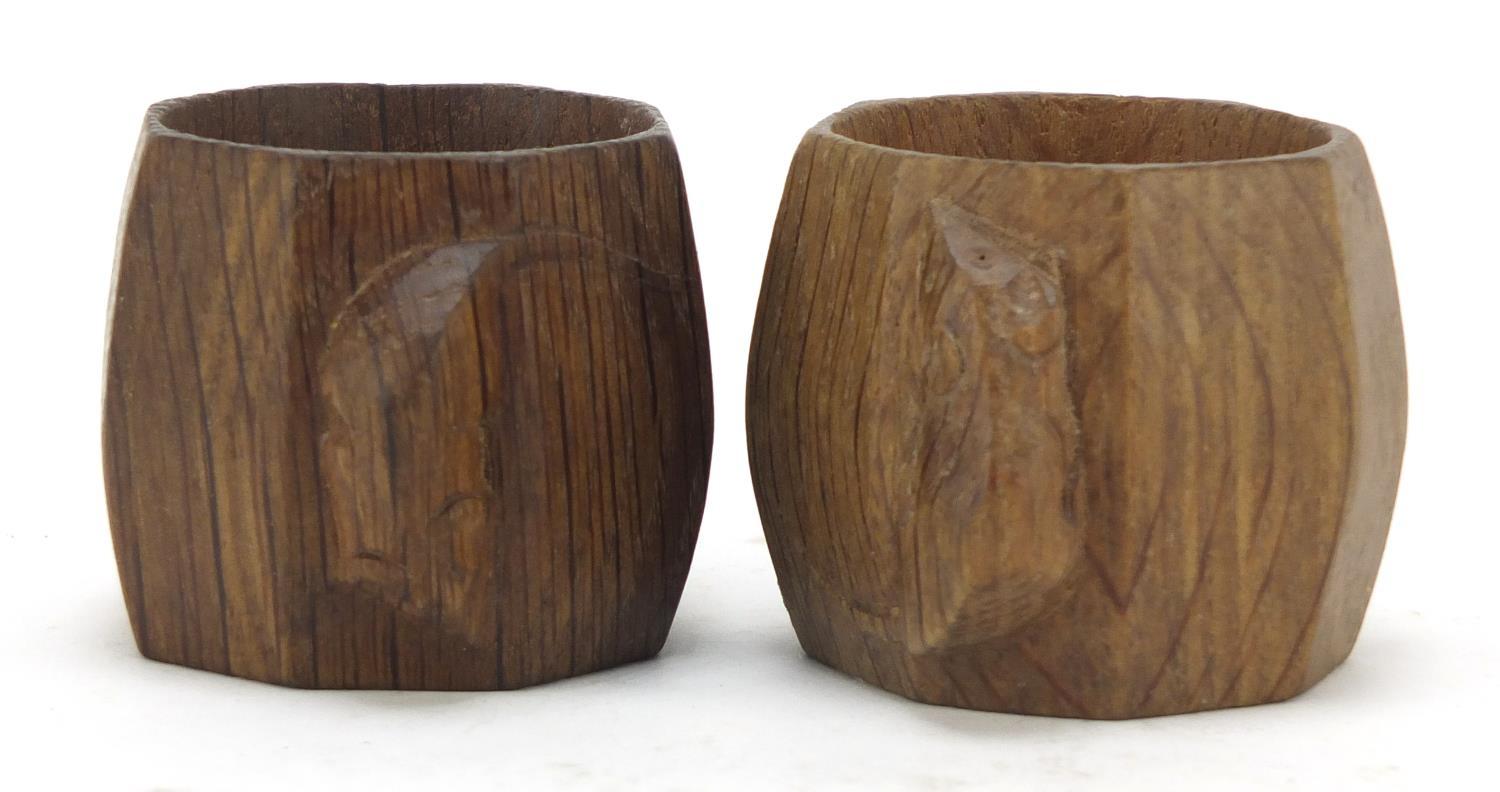 Robert Mouseman Thompson pair of octagonal adzed oak napkin rings, each carved with a signature