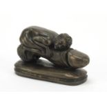 Erotic bronze model of a phallus mounted with a male, 16cm in length : For Further Condition Reports