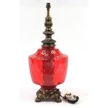 Ornate gilt metal lamp with cranberry coloured glass body, 65cm high : For Further Condition Reports