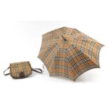 Burberrys parasol and bag, the parasol 82cm in length : For Further Condition Reports Please Visit