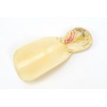 Japanese ivory shoe horn, carved with a tiger, 9cm in length : For Further Condition Reports