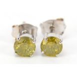Pair of 9ct white gold yellow diamond stud earrings, approximately 1 carat in total, 1.0g : For