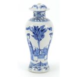 Chinese blue and white porcelain baluster vase and cover, hand painted with figures in a garden