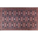 Persian rug with all over geometric design onto a predominantly blue and red ground, 225cm x 138cm :