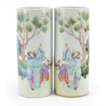 Pair of Chinese porcelain sleeve vases, hand painted in the famille rose palette with figures in a