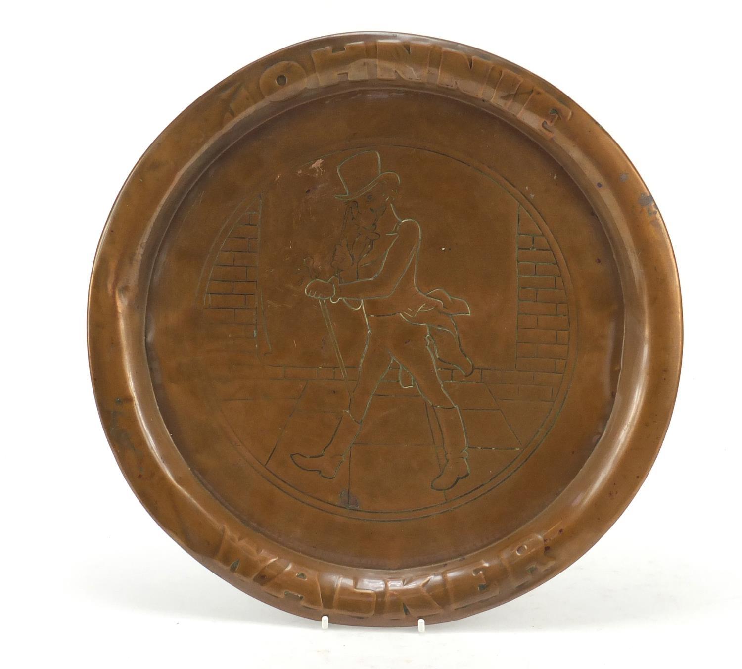 Johnny Walker advertising copper tray, 34cm in diameter : For Further Condition Reports Please Visit