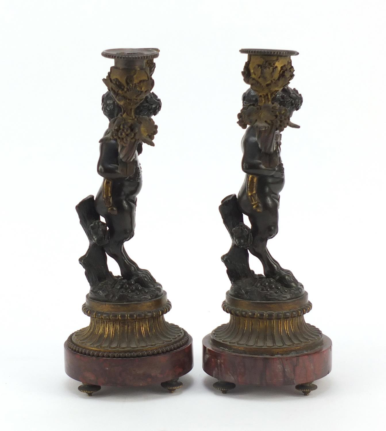 After Claude Michel Clodion, pair of 19th century patinated bronze figural two branch candlesticks - Image 6 of 8