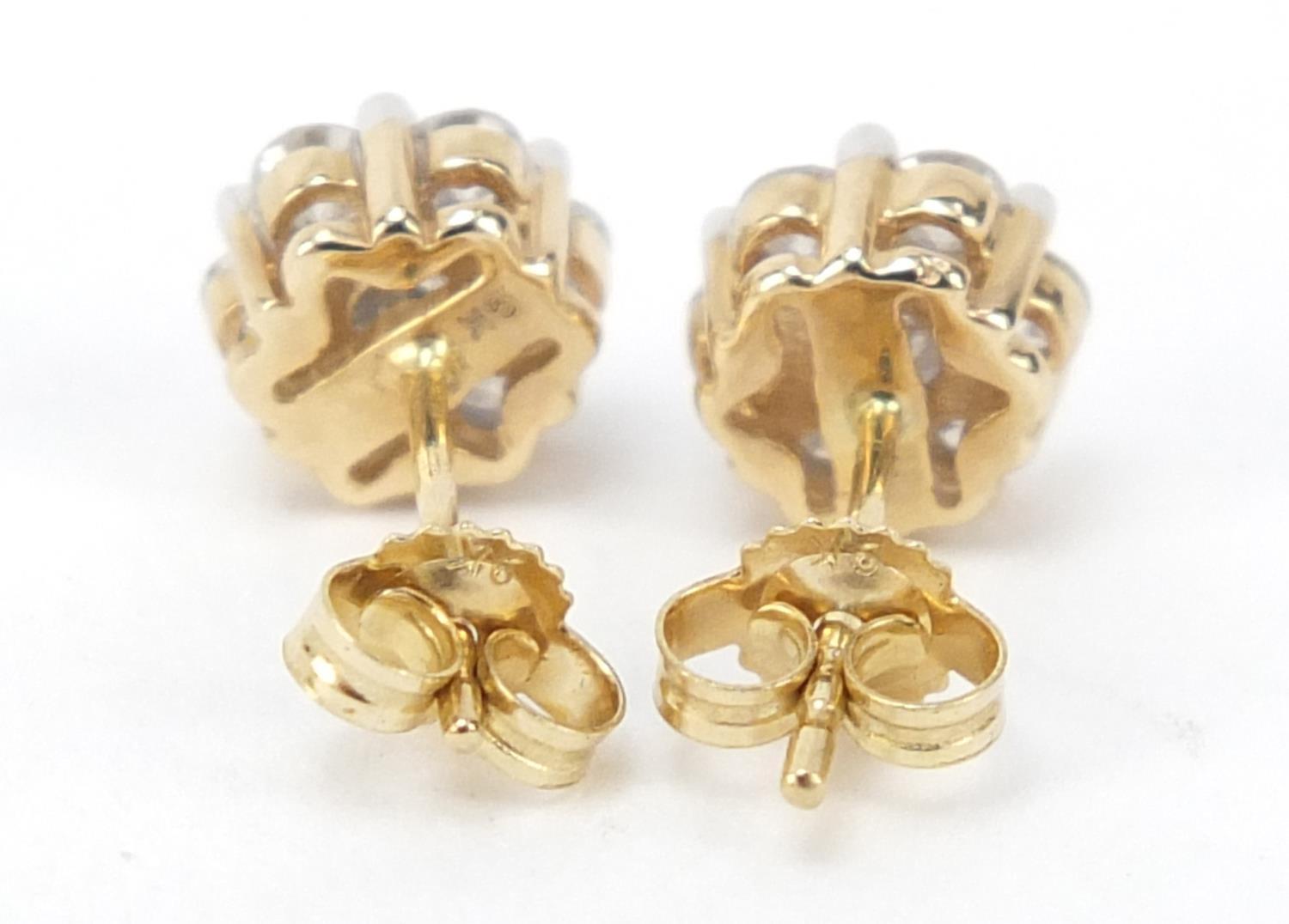 Pair of 9ct gold diamond flower head earrings, approximately 1 carat in total, 1.5g : For Further - Image 2 of 3