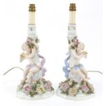 Pair of 19th century porcelain floral encrusted cherub candlesticks by Plaue, converted for electric