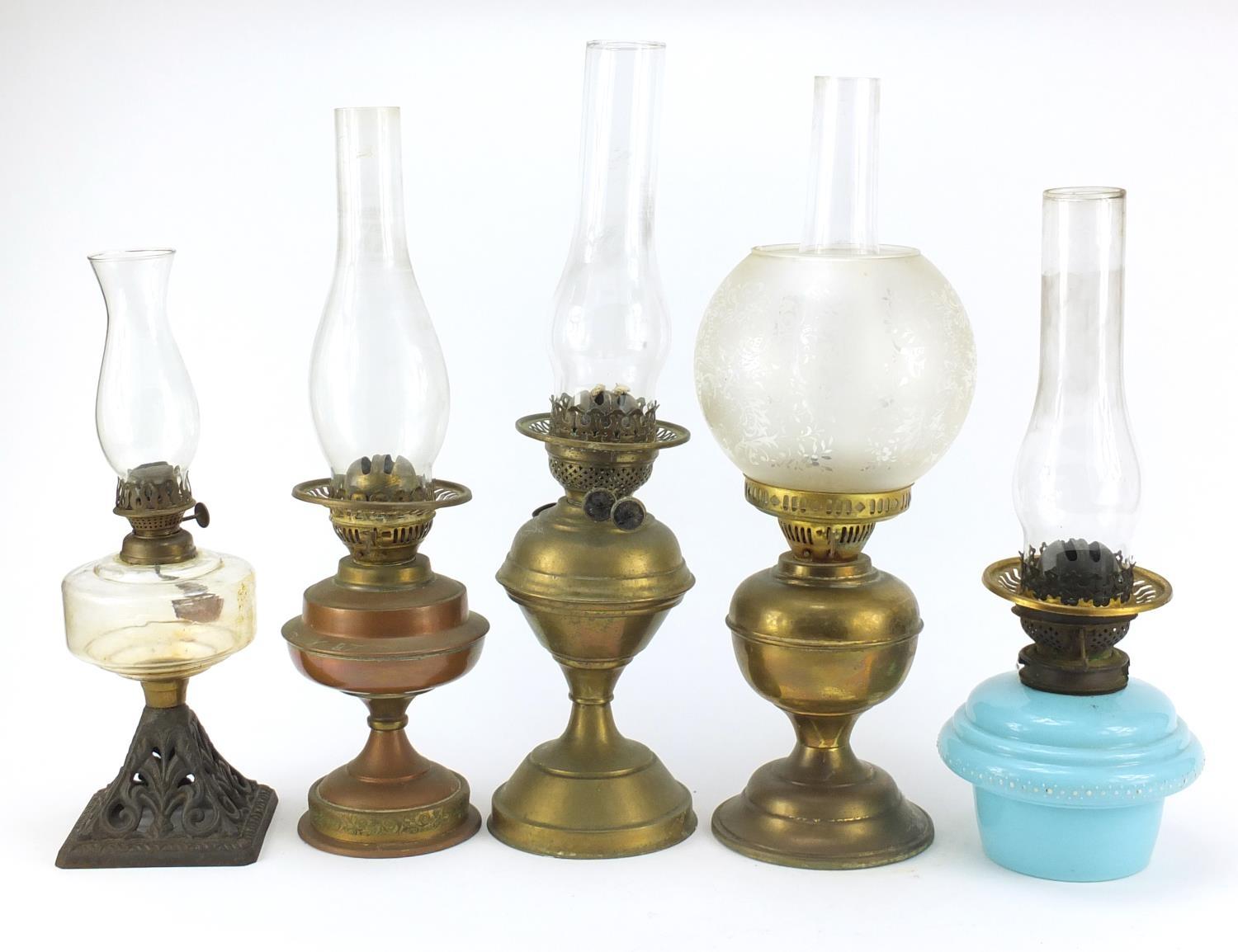 Five brass and glass oil lamps, the largest 51cm high : For Further Condition Reports Please Visit - Image 4 of 5