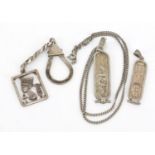 Two silver Egyptian hieroglyphic pendants on chains and a Nephertiti keyring, 31.5g : For Further