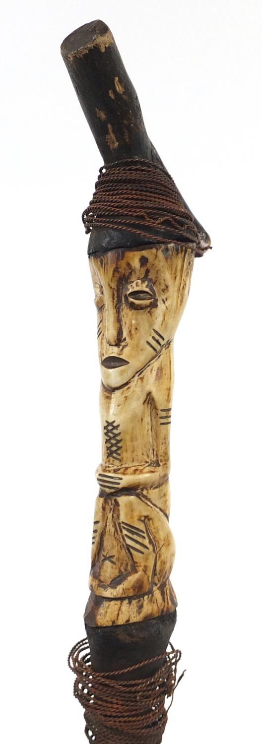 African cane with carved bone figural handle and a steel bladed sword with leather sheaf, the - Image 4 of 6