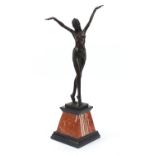 Large patinated bronze figure of a scantily dressed Art Deco female raised on a tapering marble