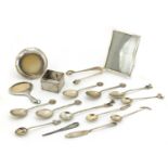 Silver and white metal objects including two miniature photo frames, sugar tongs and teaspoons,