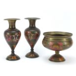 Pair of Indian enamelled brass vases and a pedestal bowl, each engraved with flowers, the largest