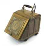 Victorian aesthetic brass coal box with iron shovel, the sloping hinged front with circular floral