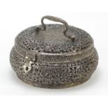 Burmese silver coloured metal pierced container embossed with flowers, 21cm in diameter, 820g :