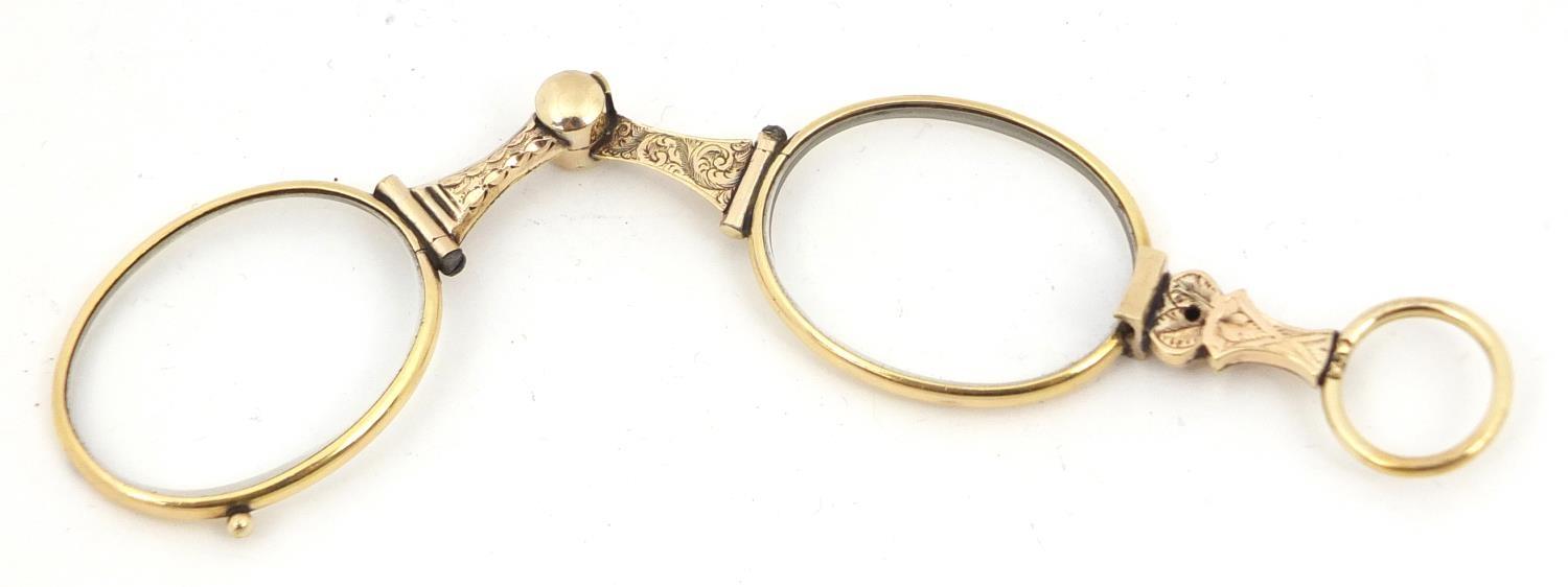 Pair of 19th century gold coloured metal folding spectacles, partially tested for 18ct and 14ct