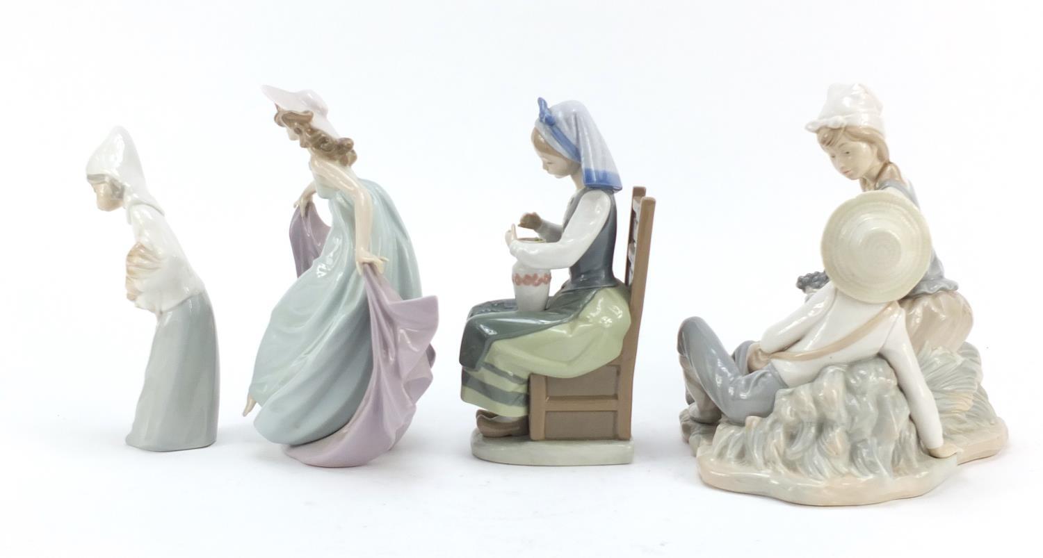 Four Lladro and Nao figure groups, the largest 23cm high : For Further Condition Reports Please - Image 4 of 10