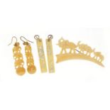 Ivory brooch in the form of an elephant bridge, pair of ivory earrings and one other pair of