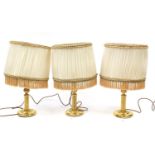 Three brass table lamps with silk lined shades with tassels, each 59cm high : For Further