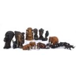 African and Indian wood carvings together with two Canadian Inuit figures and an elephant bridge,