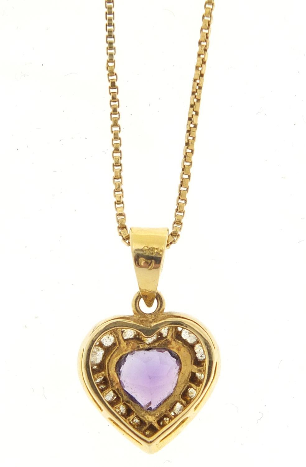 14ct gold amethyst and clear stone love heart pendant, 2cm in length on an unmarked gold coloured - Image 4 of 5