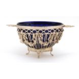 Swedish 830 silver twin handle pedestal bowl with blue glass liner, cast and pierced with bows and