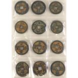 Collection of Chinese cash coins arranged in an album : For Further Condition Reports Please Visit