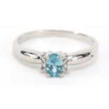 9ct white gold blue topaz and diamond ring, size S, 2.6g : For Further Condition Reports Please