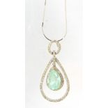 18ct white gold Columbian emerald and diamond surround pendant, 4cm in length on an 18ct white