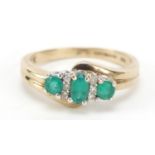 9ct gold emerald and diamond crossover ring, size M, 2.5g : For Further Condition Reports Please