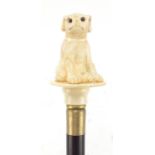 Hardwood walking stick with carved bone dog design handle, 99cm high : For Further Condition Reports