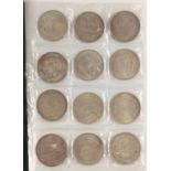 Collection of world coins arranged in an album : For Further Condition Reports Please Visit Our