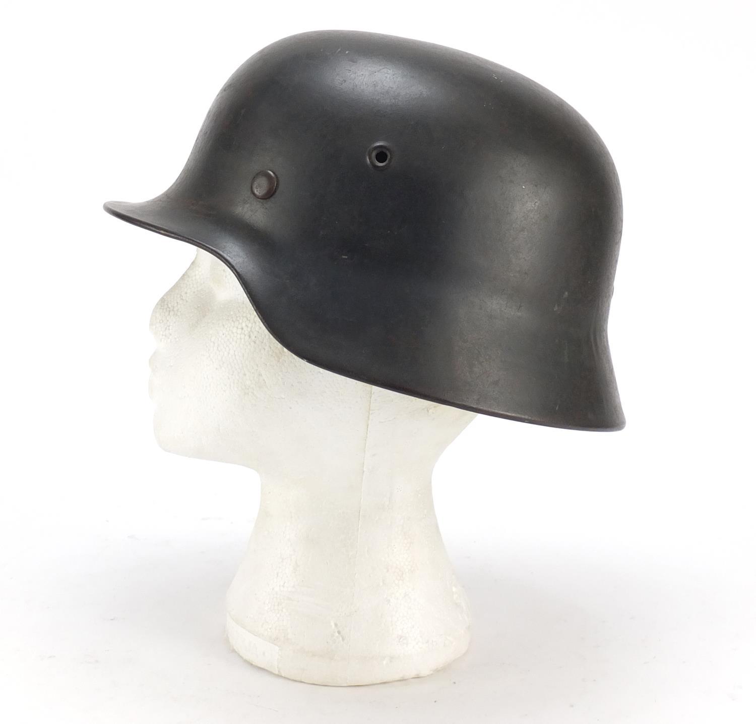 German military interest steel helmet with SS badge and leather liner, impressed 1256 and ET64 : For - Image 2 of 6