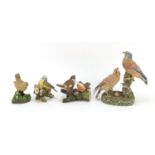Four J H Webb painted pottery bird groups, the largest 25cm high : For Further Condition Reports