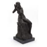 Large patinated bronze figure of a seated nude female raised on a square black marble base, 53cm