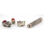 Silver items including two pincushions in the form of animals and a cheroot holder, the largest