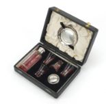 Silver plated Catholic travelling communion set housed in a fitted case, the bottle 10cm high :