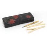 Carved bone souvenir of Brighton Stanhope pen, pair of bone glove stretchers and a lacquered pen